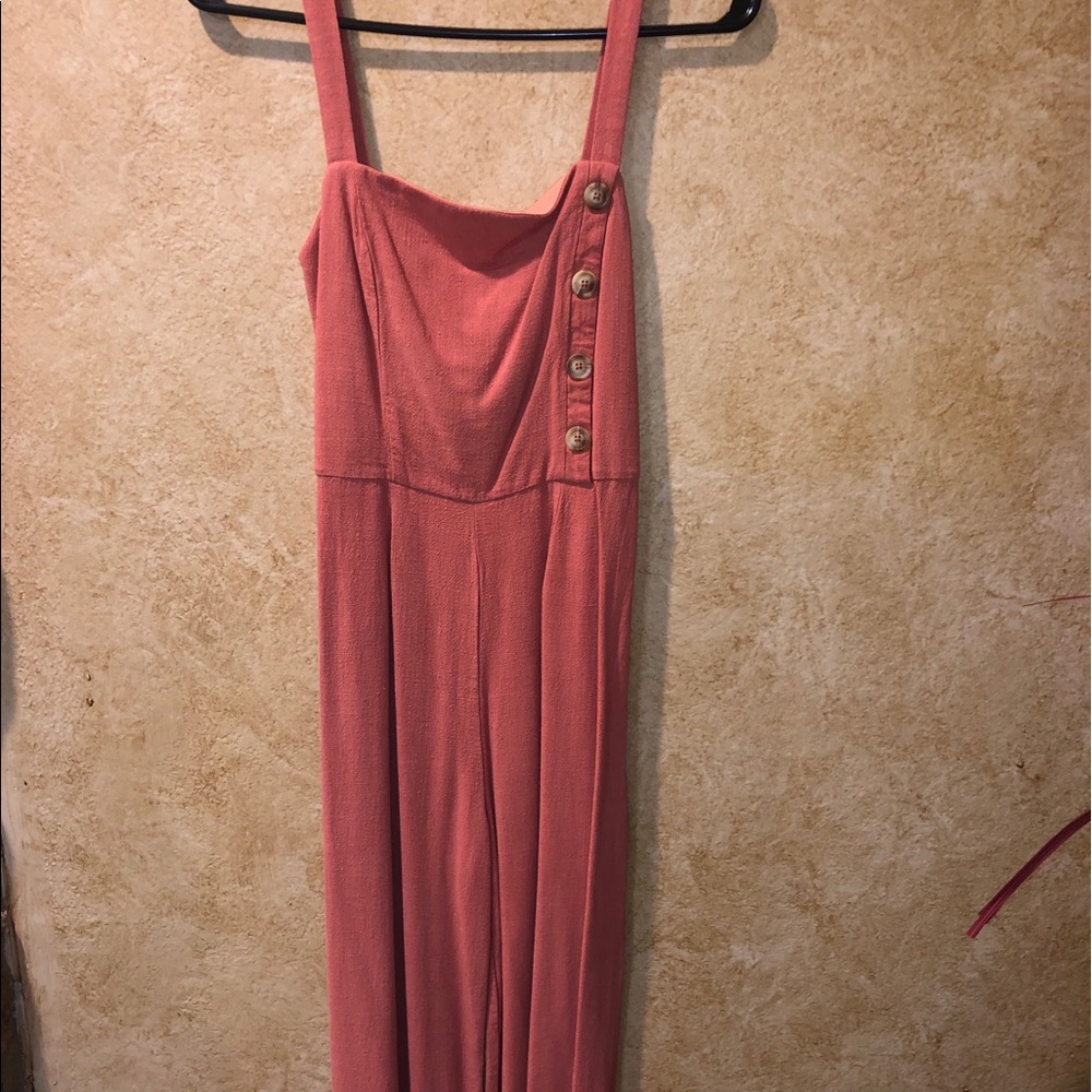 Salmon romper with buttons and waist tie.
